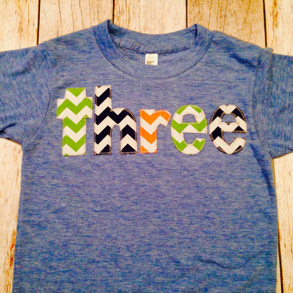 Birthday Shirt Athletic Blue Short Sleeves three in green, blue, yellow, red and orange letters